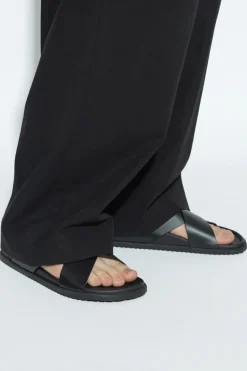 Dolce & Gabbana BLACK Leather slides with logo-shaped appliqué