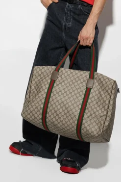 Gucci beige ‘GG Supreme’ canvas holdall bag
