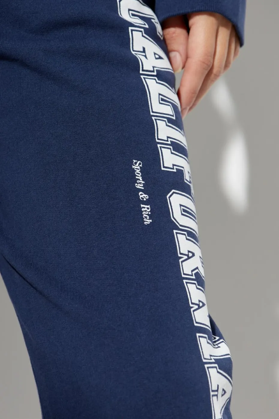 Sporty & Rich NAVY BLUE Sweatpants from the Wall Street collection